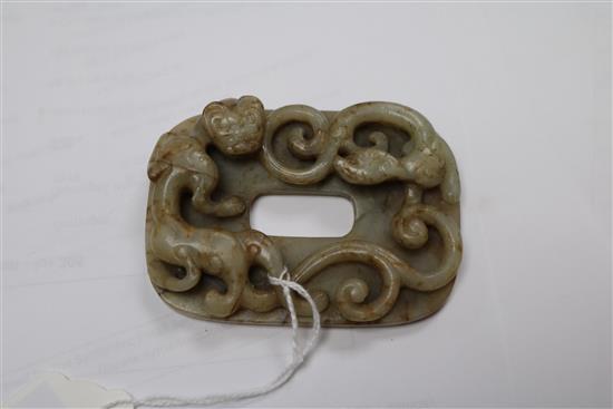 A Chinese celadon and russet jade chilong plaque, Ming dynasty 8.5cm.